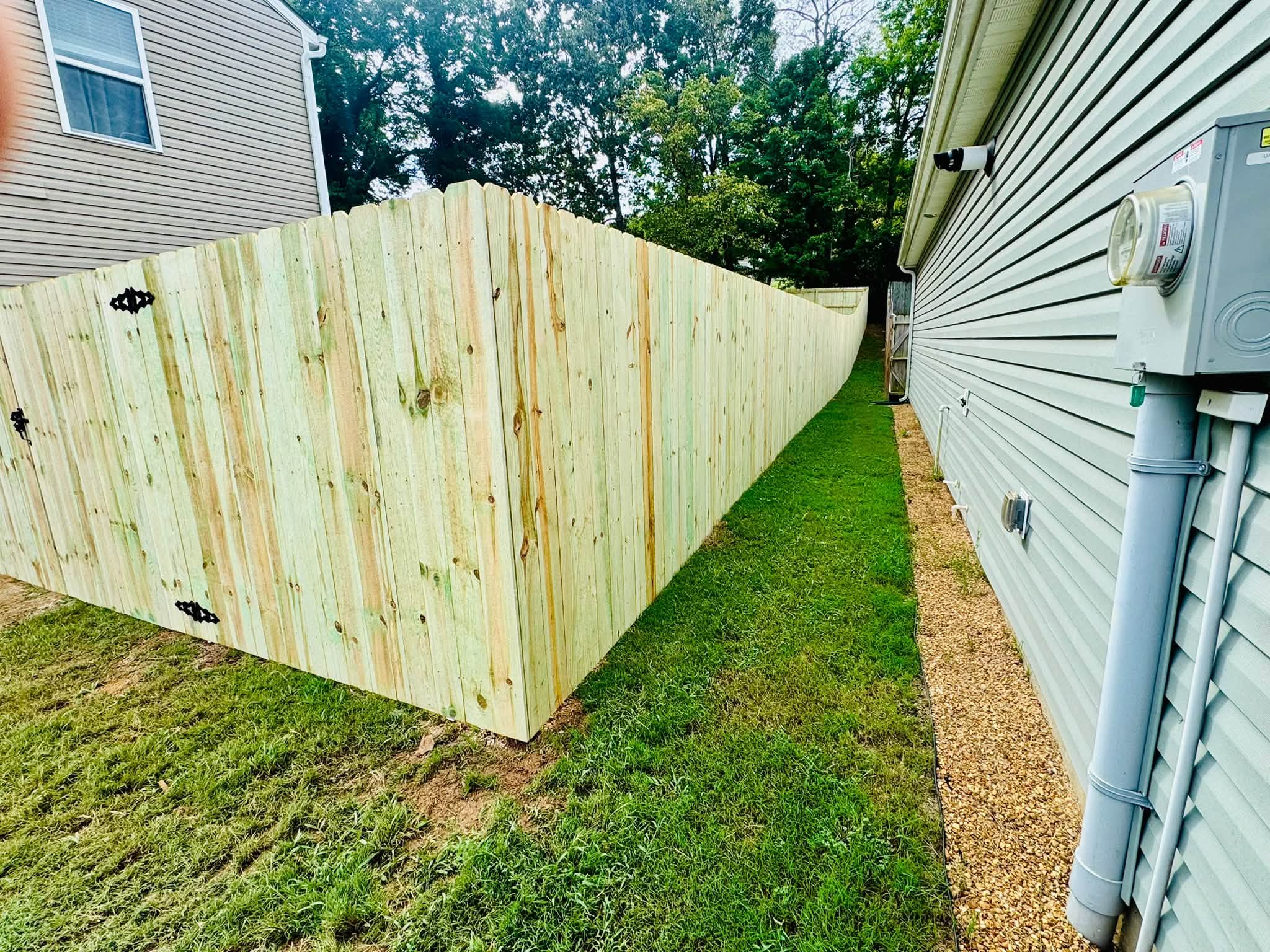 Wood privacy fence between two houses in Athens, TN